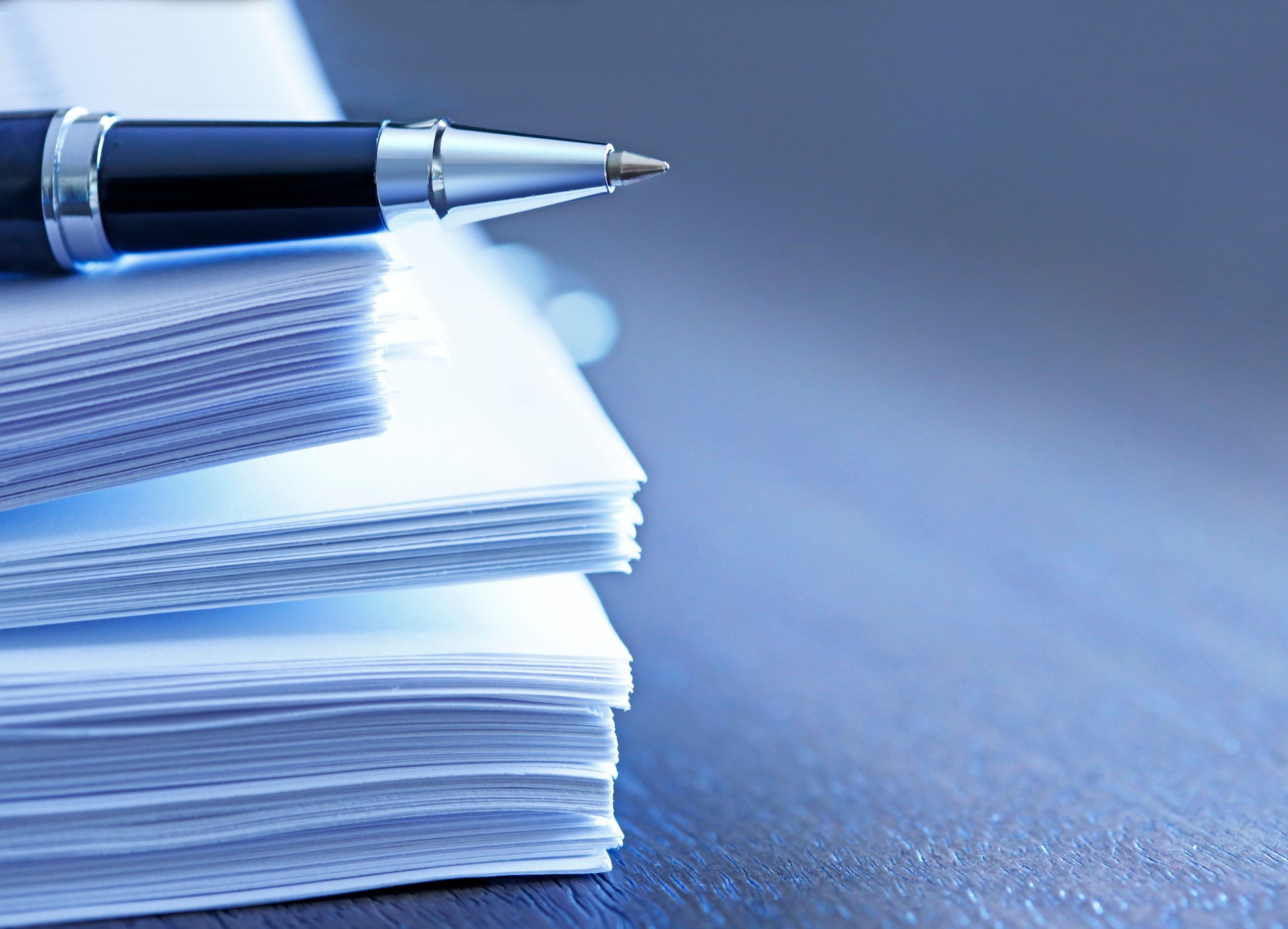 Ballpoint Pen Resting On Top Of Stack Of Documents